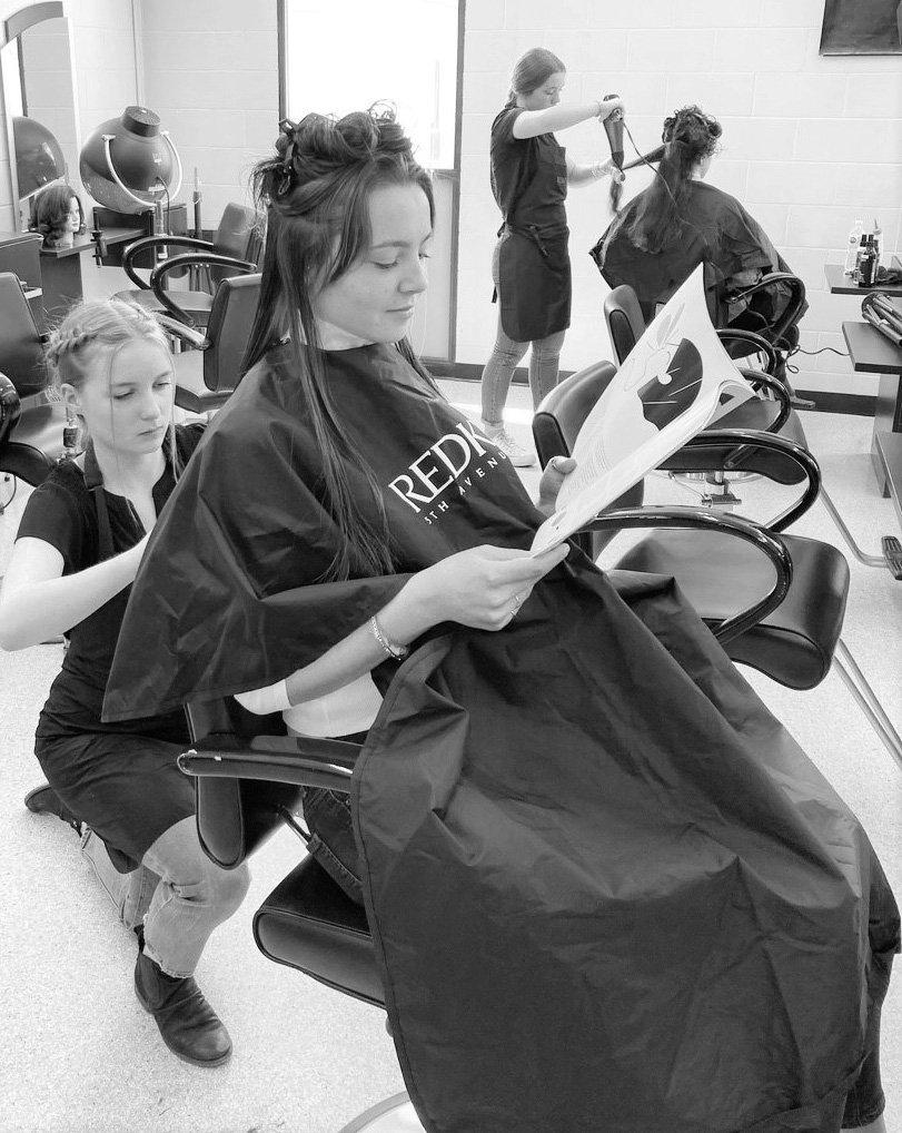 Student hairstylists in salon