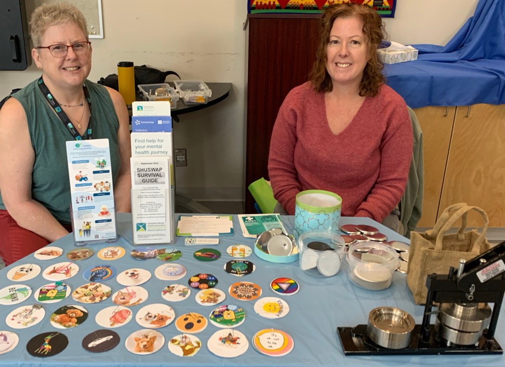 two-women-at-button-booth