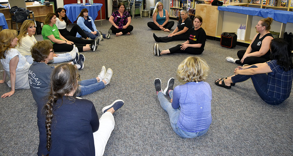 group-doing-yoga-with-Amy